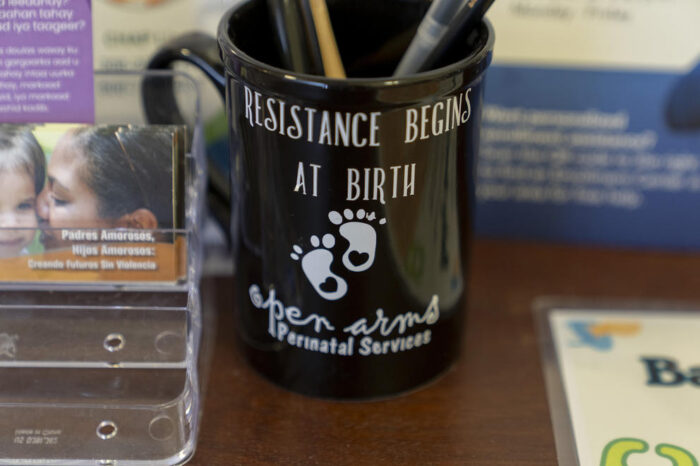 A message of empowerment on a mug outside the Open Arms Perinatal Services office at El Centro de la Raza in Seattle. (David Ryder for Crosscut)